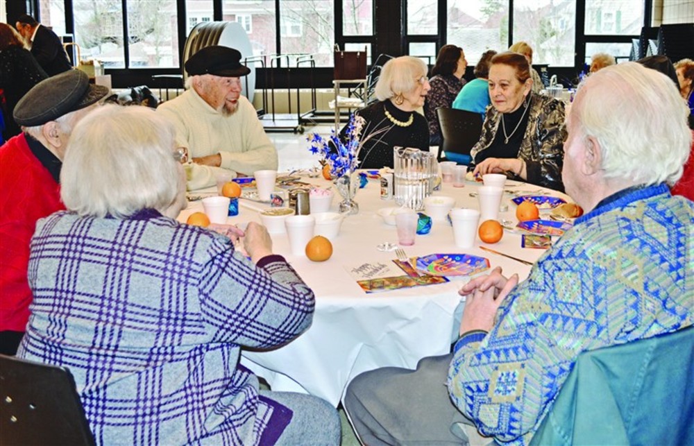 Seniors at the Kosher Café enjoyed a festive meal and Hanukkah celebration in December. Jboost.org is currently  raising funds to offer meal vouchers to seniors. /Photo| Fran Ostendorf